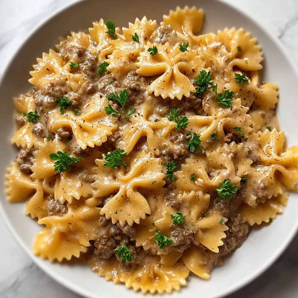 Délicieuses pâtes papillon à la viande et sauce onctueuse